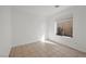 Empty bedroom featuring tile flooring and a window at 6328 Brianna Peak Ct, Las Vegas, NV 89142
