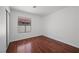 Empty bedroom featuring dark wood floors and a window at 6328 Brianna Peak Ct, Las Vegas, NV 89142