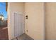 Close-up of the entrance with a security door and stucco wall at 6328 Brianna Peak Ct, Las Vegas, NV 89142