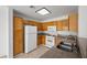 Kitchen features oak cabinets, granite counters, and white appliances at 6328 Brianna Peak Ct, Las Vegas, NV 89142