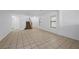 Spacious living room features neutral tile flooring and a staircase at 6328 Brianna Peak Ct, Las Vegas, NV 89142