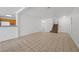 Spacious living area featuring tiled flooring, leading to the staircase and kitchen at 6328 Brianna Peak Ct, Las Vegas, NV 89142