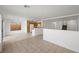 Open concept living space with tile floors leads to kitchen and stairs at 6328 Brianna Peak Ct, Las Vegas, NV 89142