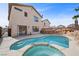 Relaxing backyard pool area with a built-in spa and a charming rock waterfall feature at 6328 Brianna Peak Ct, Las Vegas, NV 89142