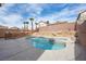 Backyard pool features rock waterfall, spa, and ample patio space, perfect for outdoor living at 6328 Brianna Peak Ct, Las Vegas, NV 89142
