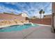 Backyard pool and spa with rock features offer a private oasis with plenty of space to enjoy at 6328 Brianna Peak Ct, Las Vegas, NV 89142