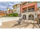 Lovely outdoor patio with seating and lush landscaping at 64 Strada Principale # 201, Henderson, NV 89011