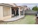 Spacious backyard features covered patio and artificial turf at 6445 Glory Rise Ct, Las Vegas, NV 89142