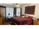 Bedroom with ample natural light, wood floors, and comfortable furnishings at 6445 Glory Rise Ct, Las Vegas, NV 89142