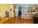 Spacious kitchen with wooden cabinets and large island is adjacent to the living area at 6445 Glory Rise Ct, Las Vegas, NV 89142