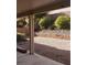 The backyard has a brick retaining wall and lush bushes at 6541 Chinatown St, Las Vegas, NV 89166