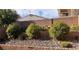 Backyard featuring landscaping with bushes and retaining walls at 6541 Chinatown St, Las Vegas, NV 89166