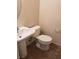 A half bathroom featuring a pedestal sink and tiled flooring at 6541 Chinatown St, Las Vegas, NV 89166
