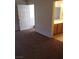Spacious bedroom featuring neutral carpeting and a doorway to the en-suite bathroom at 6541 Chinatown St, Las Vegas, NV 89166