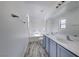 Bright bathroom with double sink vanity, large mirror, and shower-tub combination at 6552 Coldwater Bay Dr, Las Vegas, NV 89122