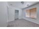 Bedroom with neutral carpet, window, and closet with sliding doors at 6552 Coldwater Bay Dr, Las Vegas, NV 89122