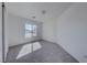 Bright bedroom with a large window letting in natural light and neutral carpeting at 6552 Coldwater Bay Dr, Las Vegas, NV 89122