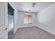 Cozy bedroom with neutral carpet, window, and closet at 6552 Coldwater Bay Dr, Las Vegas, NV 89122