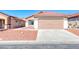 Charming single-story home with a two-car garage and desert landscaping at 6552 Coldwater Bay Dr, Las Vegas, NV 89122
