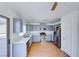 Modern kitchen with stainless steel appliances and light blue cabinetry at 6552 Coldwater Bay Dr, Las Vegas, NV 89122