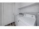 Functional laundry room with included washer and dryer units and storage shelf at 6552 Coldwater Bay Dr, Las Vegas, NV 89122