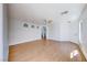 Spacious living room with wood floors, white walls, and a ceiling fan at 6552 Coldwater Bay Dr, Las Vegas, NV 89122