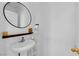 Clean half bathroom with modern sink, mirror and floating shelf at 6817 Frances Celia Ave, Las Vegas, NV 89122