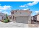 Lovely two-story home featuring a spacious driveway, attached two-car garage, and well-kept landscaping at 6817 Frances Celia Ave, Las Vegas, NV 89122