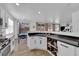 Modern kitchen featuring white cabinets, granite counters, and stainless steel appliances at 6817 Frances Celia Ave, Las Vegas, NV 89122