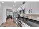 Gourmet kitchen with stainless steel appliances and elegant white cabinetry at 6817 Frances Celia Ave, Las Vegas, NV 89122