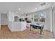 Bright kitchen and dining area featuring white cabinets and modern appliances at 6817 Frances Celia Ave, Las Vegas, NV 89122