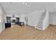 Spacious living room with hardwood floors and elegant staircase to the upper level at 6817 Frances Celia Ave, Las Vegas, NV 89122