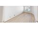 Bedroom featuring bright wood laminate floors and natural light at 6944 Emerald Springs Ln, Las Vegas, NV 89113