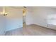 Bright bedroom featuring wood laminate floors, closet, and natural light at 6944 Emerald Springs Ln, Las Vegas, NV 89113