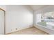 Bedroom featuring a window with view and bright wood laminate floors at 6944 Emerald Springs Ln, Las Vegas, NV 89113