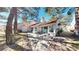 Charming home with a well-maintained lawn and patio space perfect for outdoor entertaining at 6944 Emerald Springs Ln, Las Vegas, NV 89113
