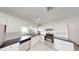 Bright kitchen featuring stainless steel appliances, white cabinets, and marble tile floors at 6944 Emerald Springs Ln, Las Vegas, NV 89113