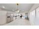 Updated kitchen with stainless steel appliances, white cabinetry, and granite countertops at 6944 Emerald Springs Ln, Las Vegas, NV 89113