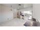 Spacious kitchen with white cabinets, stainless steel appliances, and marble tile floor at 6944 Emerald Springs Ln, Las Vegas, NV 89113