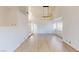 Open-concept living room featuring hardwood floors and abundant natural light at 6944 Emerald Springs Ln, Las Vegas, NV 89113
