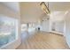 Spacious living room with hardwood floors, high ceilings, fireplace, and lots of natural light at 6944 Emerald Springs Ln, Las Vegas, NV 89113