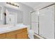 Bathroom showcasing a vanity, toilet, mirror, light fixture, and a glass shower enclosure at 7213 Buglehorn St, Las Vegas, NV 89131