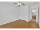 Bright bedroom with a ceiling fan, wood floors, and closet doors at 7213 Buglehorn St, Las Vegas, NV 89131
