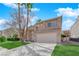 Charming two-story home with a well-maintained lawn and desert landscaping in a residential neighborhood at 7213 Buglehorn St, Las Vegas, NV 89131