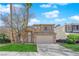 Charming two-story home with a well-maintained lawn and desert landscaping in a residential neighborhood at 7213 Buglehorn St, Las Vegas, NV 89131