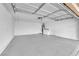 Spacious two-car garage featuring sealed concrete floor and modern utilities at 7213 Buglehorn St, Las Vegas, NV 89131