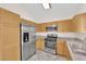 Bright kitchen boasts stainless steel appliances and plenty of cabinet space at 7213 Buglehorn St, Las Vegas, NV 89131