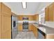 Well-lit kitchen features stainless steel appliances and ample counter space at 7213 Buglehorn St, Las Vegas, NV 89131