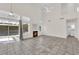 Bright living room with tile flooring, fireplace, natural light and sliding glass doors to the backyard at 7213 Buglehorn St, Las Vegas, NV 89131