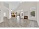 Bright living room boasts high ceilings, fireplace, and flows into the kitchen at 7213 Buglehorn St, Las Vegas, NV 89131